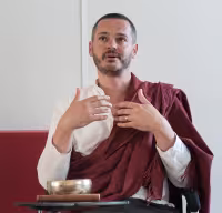 Young man gesturing while teaching