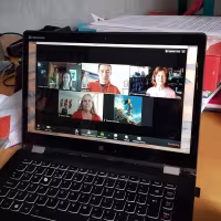 Group discussion on laptop