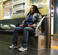 Woman meditating on train